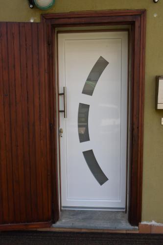 a large door with a letter s on it at Casa Il Grande Pino in Tirano