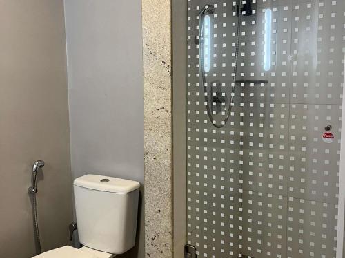 a bathroom with a shower with a toilet in it at ibis Catalao in Catalão