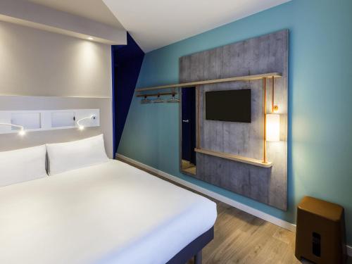 Кровать или кровати в номере ibis budget Amsterdam City South