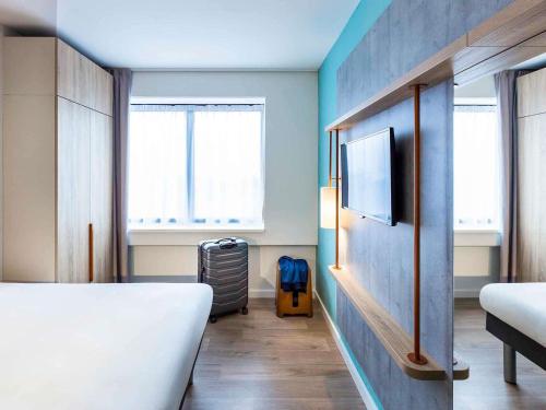 Кровать или кровати в номере ibis budget Amsterdam City South