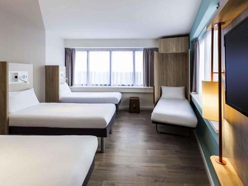 Кровать или кровати в номере ibis budget Amsterdam City South