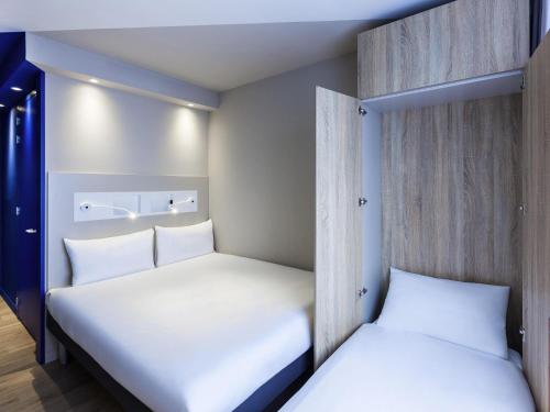 Кровать или кровати в номере ibis budget Amsterdam City South