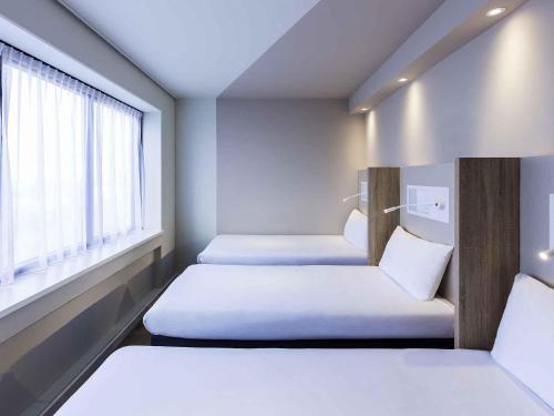 Кровать или кровати в номере ibis budget Amsterdam City South