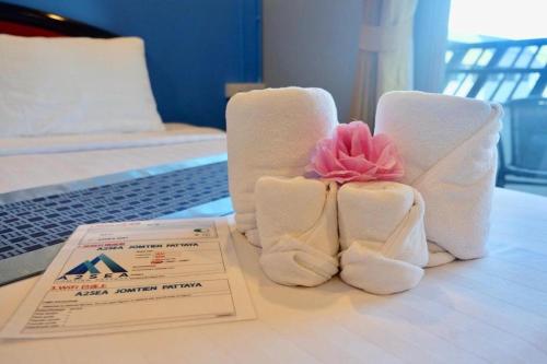 Un ou plusieurs lits dans un hébergement de l'établissement A2Sea Hotel