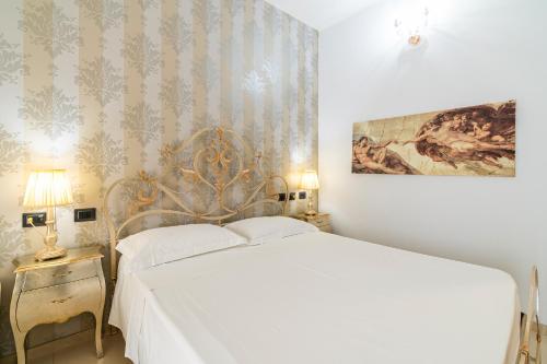 Ένα ή περισσότερα κρεβάτια σε δωμάτιο στο Villa Floyd Charming Rooms