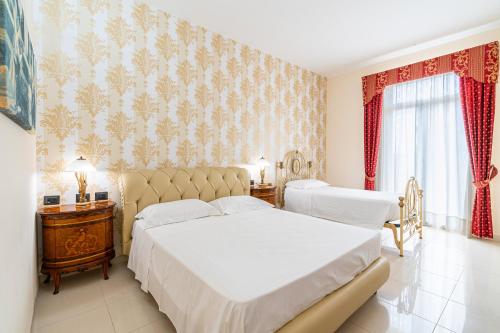 Ένα ή περισσότερα κρεβάτια σε δωμάτιο στο Villa Floyd Charming Rooms
