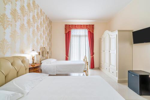Ένα ή περισσότερα κρεβάτια σε δωμάτιο στο Villa Floyd Charming Rooms