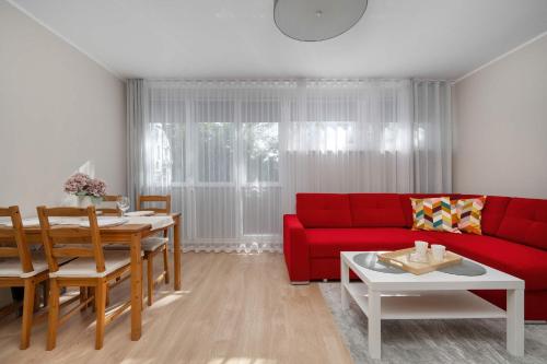 Red Apartment in Wrocław with Two Bedrooms and Desk for Remote Work by Noclegi Renters