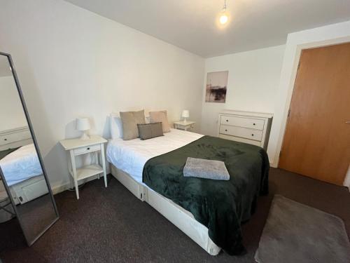 Postel nebo postele na pokoji v ubytování City Centre Apartment