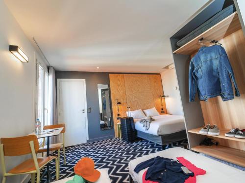 a hotel room with a bedroom with a bed at Ibis Styles Paris Place d'Italie - Butte Aux Cailles in Paris