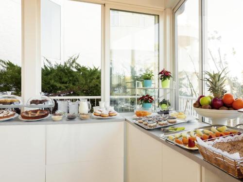 a breakfast buffet with fruit on a counter at Ibis Styles Bari Giovinazzo in Giovinazzo