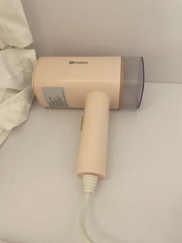 a hair dryer is attached to a wall at Aeon Tower Executive Suite in Davao City