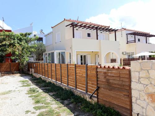 a fence in front of a house at Naya Home - New listing! in Almirida