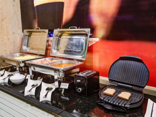 a display of food on a counter in a restaurant at ibis Paranagua in Paranaguá