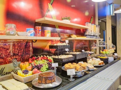 a buffet with many different types of food on display at ibis Paranagua in Paranaguá