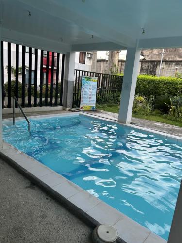 a large swimming pool with blue water at Jb Place Hernan in Cebu City