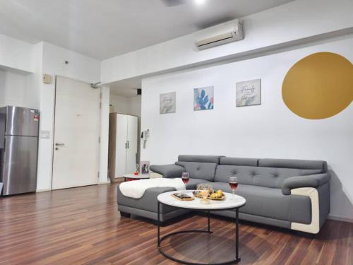 a living room with a couch and a table at SQ31 Sq where 55 inch 4 ktv sungai buloh in Shah Alam