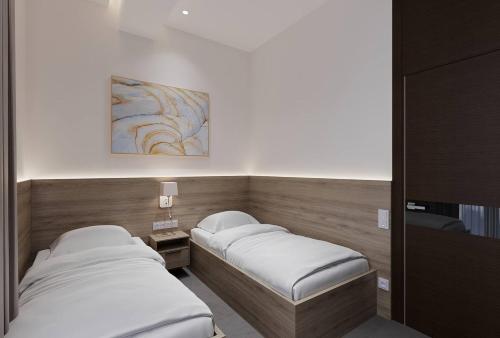 Кровать или кровати в номере Energy hotel Tashkent
