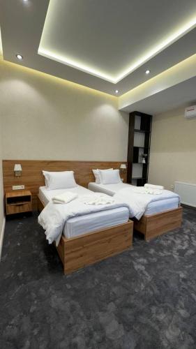 Кровать или кровати в номере Energy hotel Tashkent