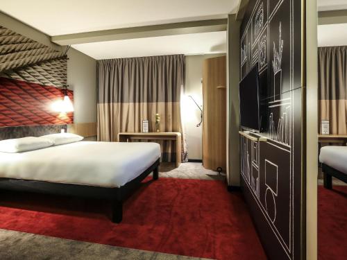 Ένα ή περισσότερα κρεβάτια σε δωμάτιο στο Ibis Niort Est Mendes France