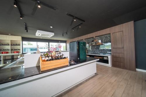 a kitchen with a counter with fruit on it at 九雅集 The Nine Refined Retreats in Rawai Beach
