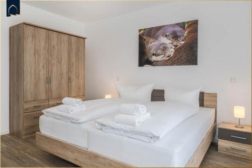 Postel nebo postele na pokoji v ubytování An der Haffküste Otterhöhle