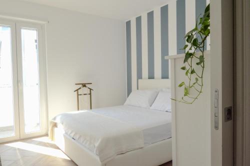 Postel nebo postele na pokoji v ubytování 60 passi dal mare-Charming CdO