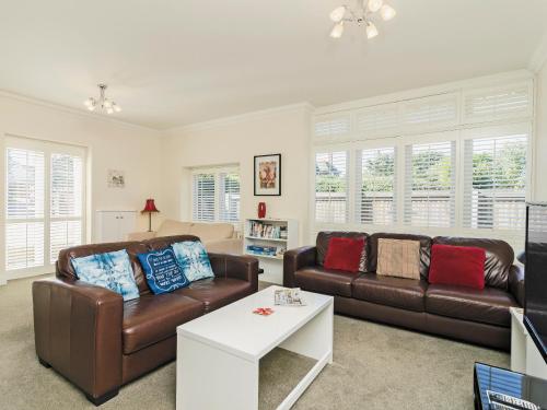 a living room with two couches and a coffee table at Owls Croft - 27898 in Broadstairs