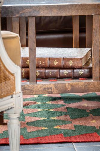 a stack of books sitting on top of a table at Gite à la ferme, authentique & accessible PMR 