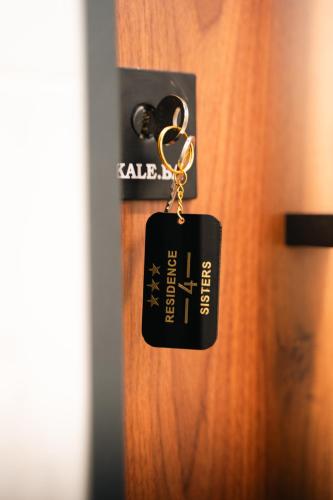 a key chain is hanging on a door at Apartmani Residence4sisters in Zvornik