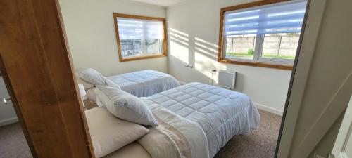 En eller flere senge i et værelse på Patagonia Oriente