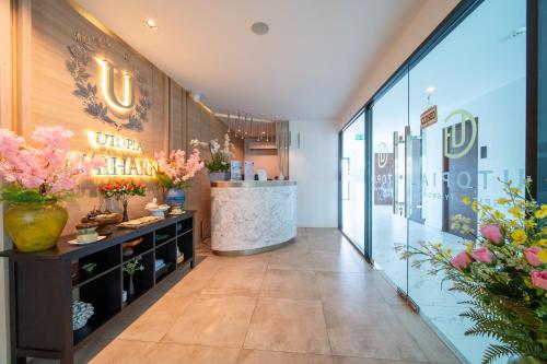 a lobby of a flower shop with flowers on the wall at 九雅集 The Nine Refined Retreats in Rawai Beach
