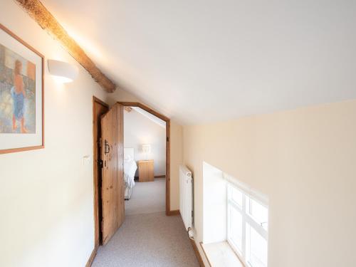 a hallway with a door leading to a bedroom at Top House in Forden