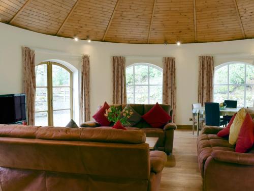 a living room with two couches and a tv at Horsemill - Uk10794 in Ballingry