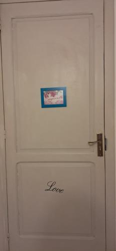 a white door with a picture on it at Il Posticino in Laurino