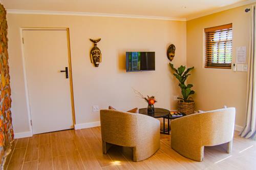 Televisyen dan/atau pusat hiburan di Ikhaya Safari Lodge