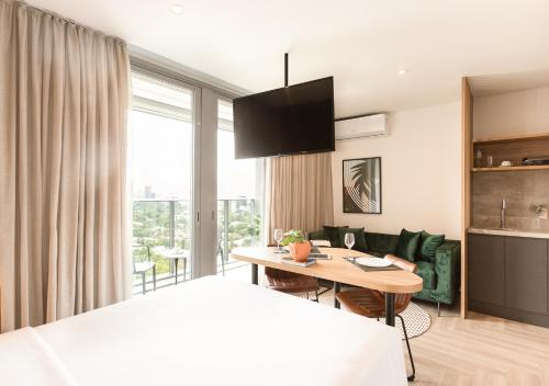 En eller flere senge i et værelse på Charlie Wide Pinheiros