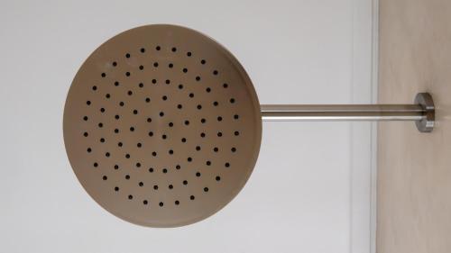 a pot hanging on the door of a bathroom at Salt and Sand in Wilderness