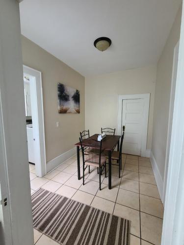 a dining room with a table and chairs at Beautiful historic home with southern charm in Lumberton