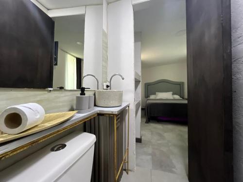 Ένα ή περισσότερα κρεβάτια σε δωμάτιο στο Hostel la Antigua Capsula