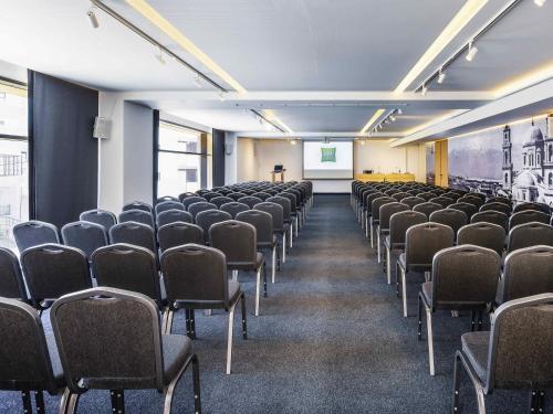 an empty lecture room with chairs and a podium at Ibis Styles Heraklion Central in Heraklio Town