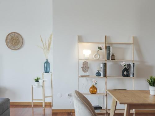 a living room with a table and a dining room at Dom Carlos Villa in Vila Nova de Gaia