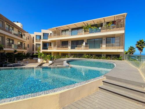 a building with a swimming pool in front of a building at Casa Tina in Casablanca