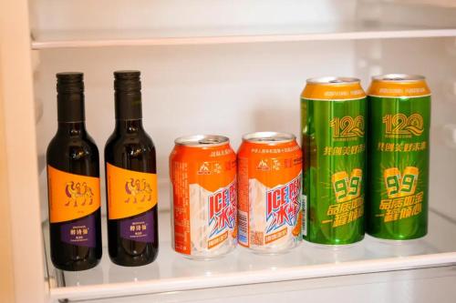 a refrigerator filled with bottles and cans of beer at Lu Ming Beiyuan Xi'an Zhongdu Drum Tower City Wall Store in Xi'an