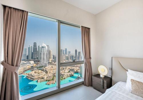 Ένα ή περισσότερα κρεβάτια σε δωμάτιο στο Grande Signature 2BR Burj Khalifa & Dubai Fountain