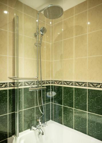 a bathroom with a shower and a sink at Blue Ball Inn in Lynmouth