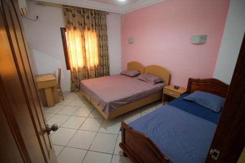 Ένα ή περισσότερα κρεβάτια σε δωμάτιο στο Residence Ahlem