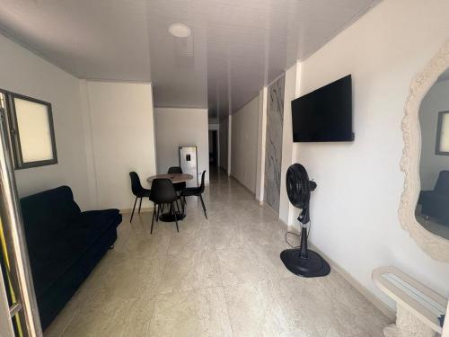 a living room with a couch and a table at Almaré apartamento en Cartagena in Cartagena de Indias