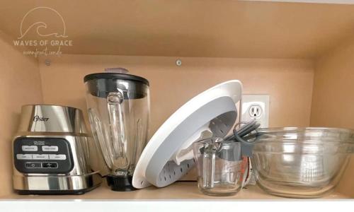 a kitchen counter with a blender and other appliances at Waves of Grace Apartment Oceanfront SeaWatch Resort in Myrtle Beach