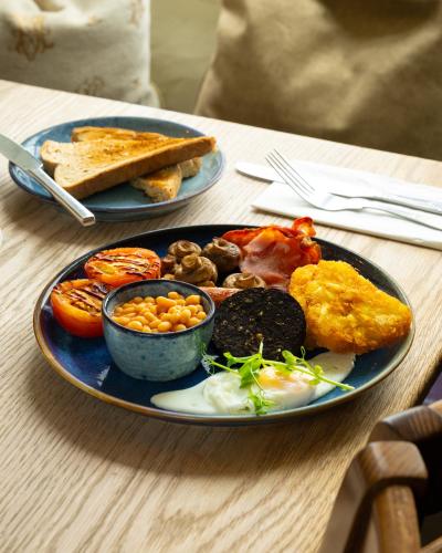 two plates of breakfast food on a table at Blue Ball Inn in Lynmouth